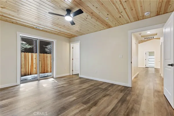 a view of a livingroom with wooden floor