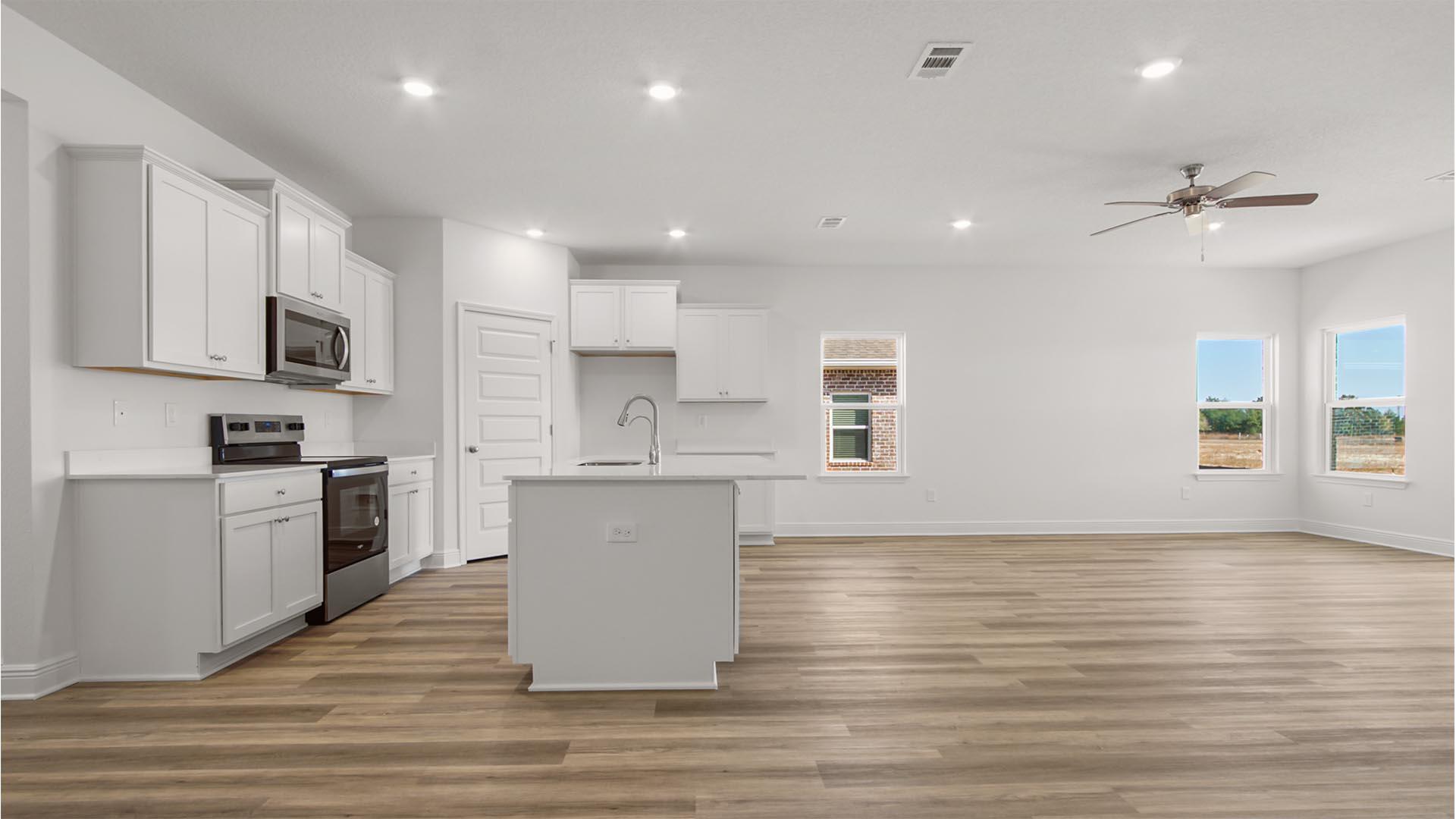 68 Foxtrail Run Freeport, FL 32439 - Photo 3 of 17 a kitchen with a refrigerator and white cabinets