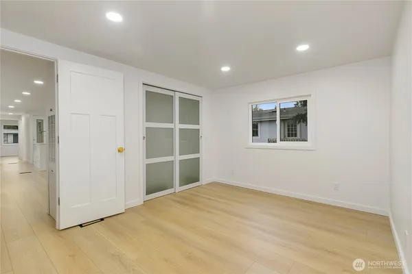 an empty room with a empty space and windows