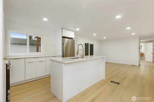 a view of a kitchen with a sink