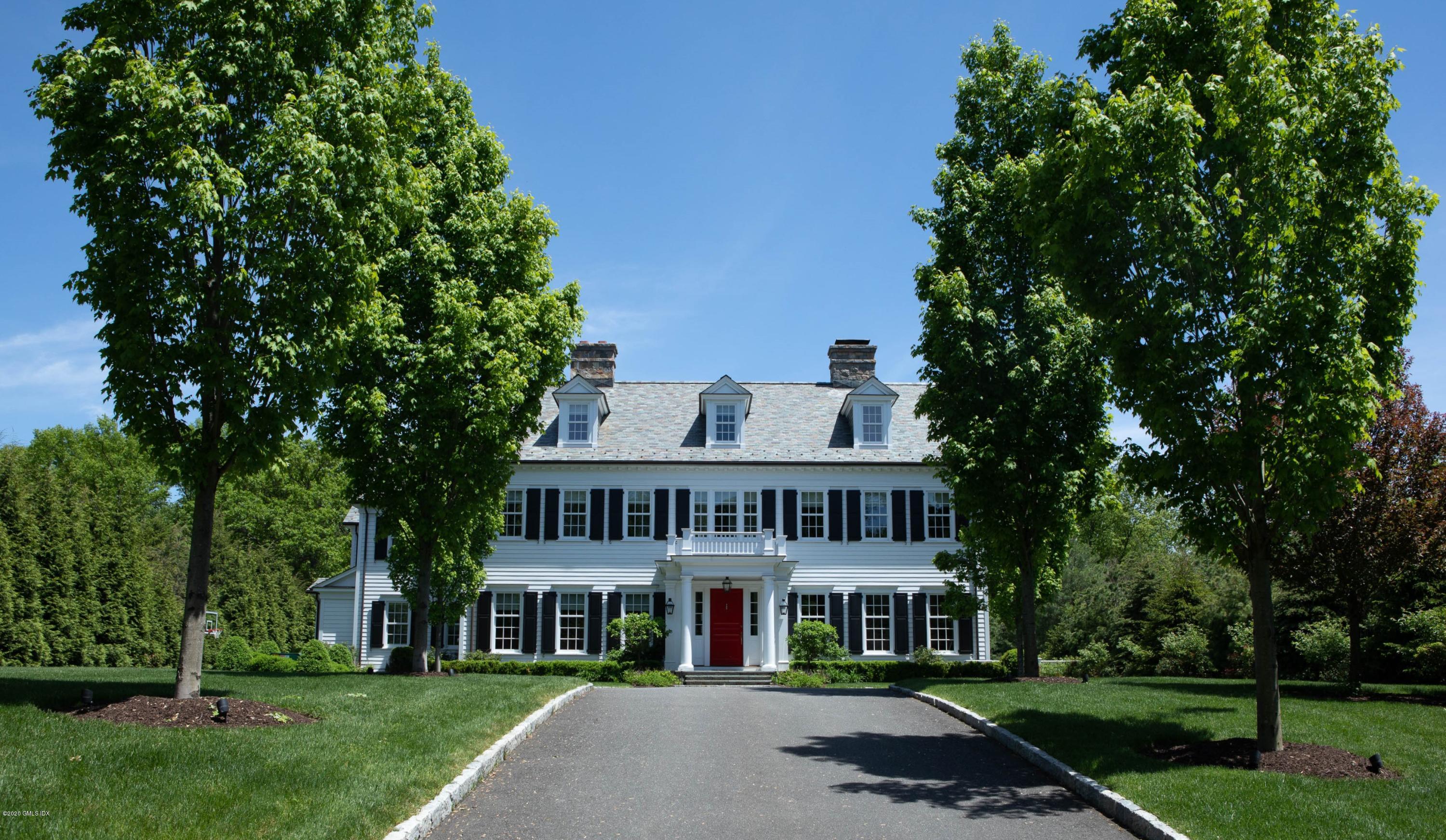 751 Lake Avenue Greenwich, CT 06830 - Photo 1 of 38 a front view of a house with a garden