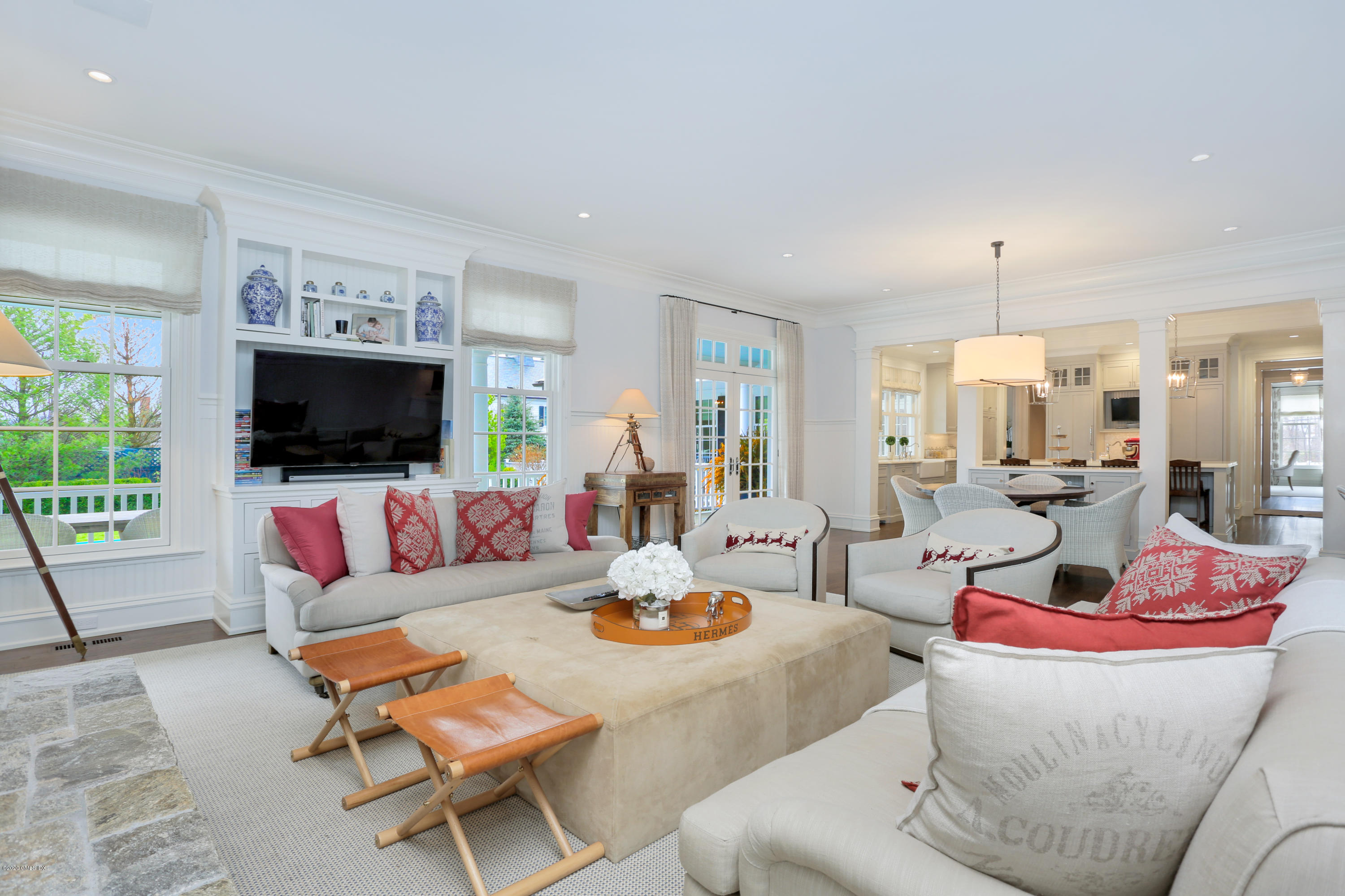 751 Lake Avenue Greenwich, CT 06830 - Photo 11 of 38 a living room with furniture flat screen tv and a large window