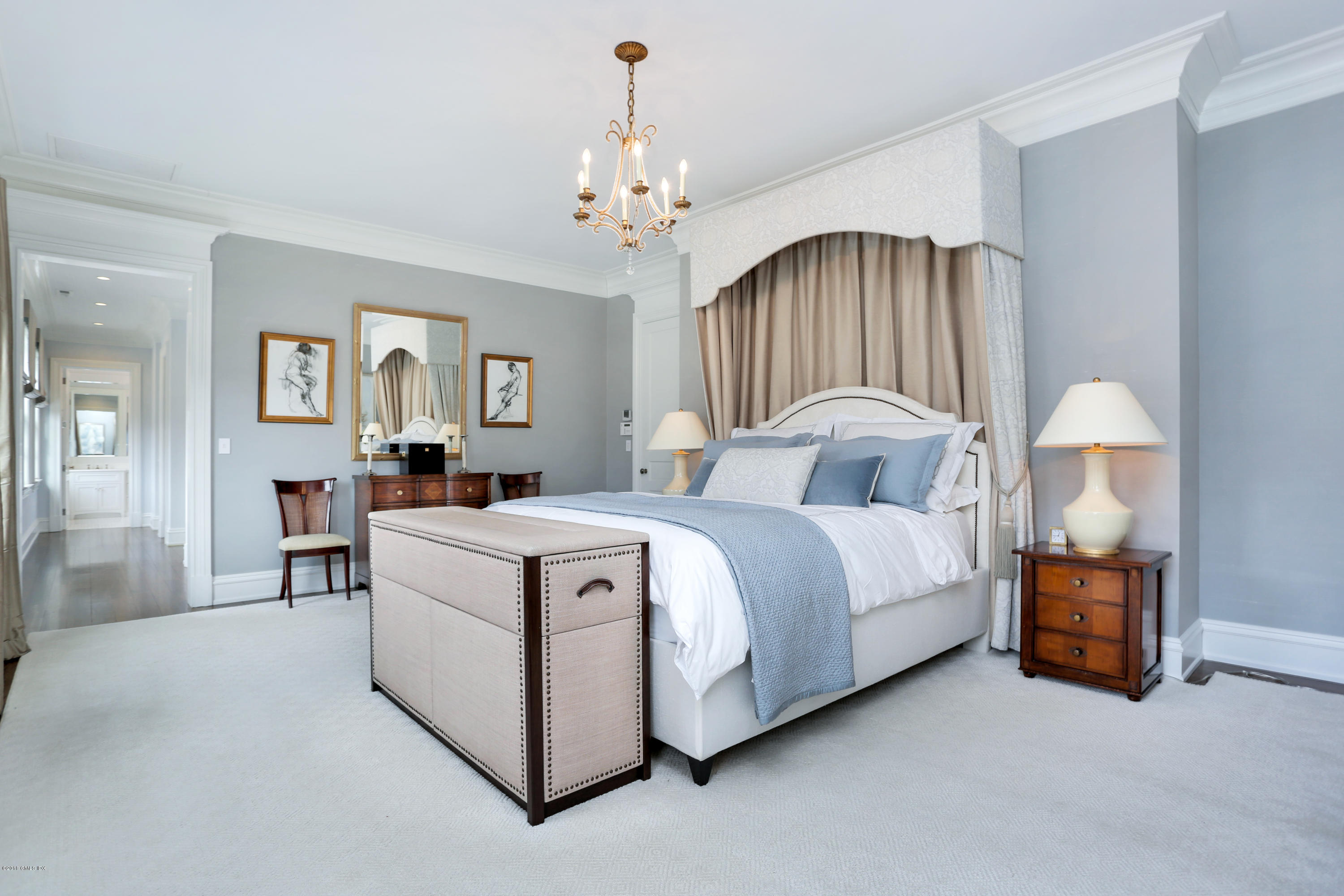 751 Lake Avenue Greenwich, CT 06830 - Photo 16 of 38 a spacious bedroom with bed and a chandelier