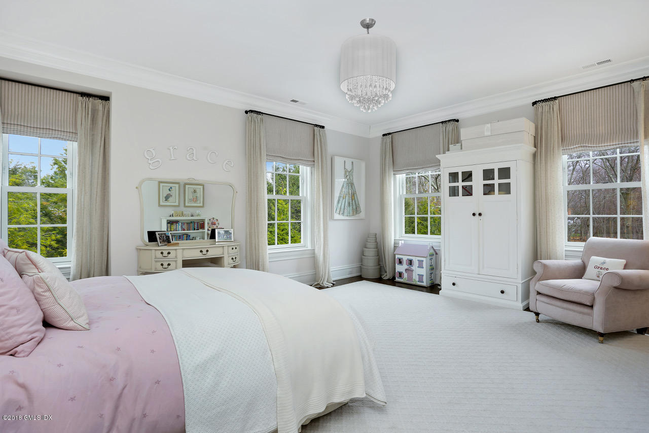 751 Lake Avenue Greenwich, CT 06830 - Photo 19 of 38 a bedroom with a large bed and a window