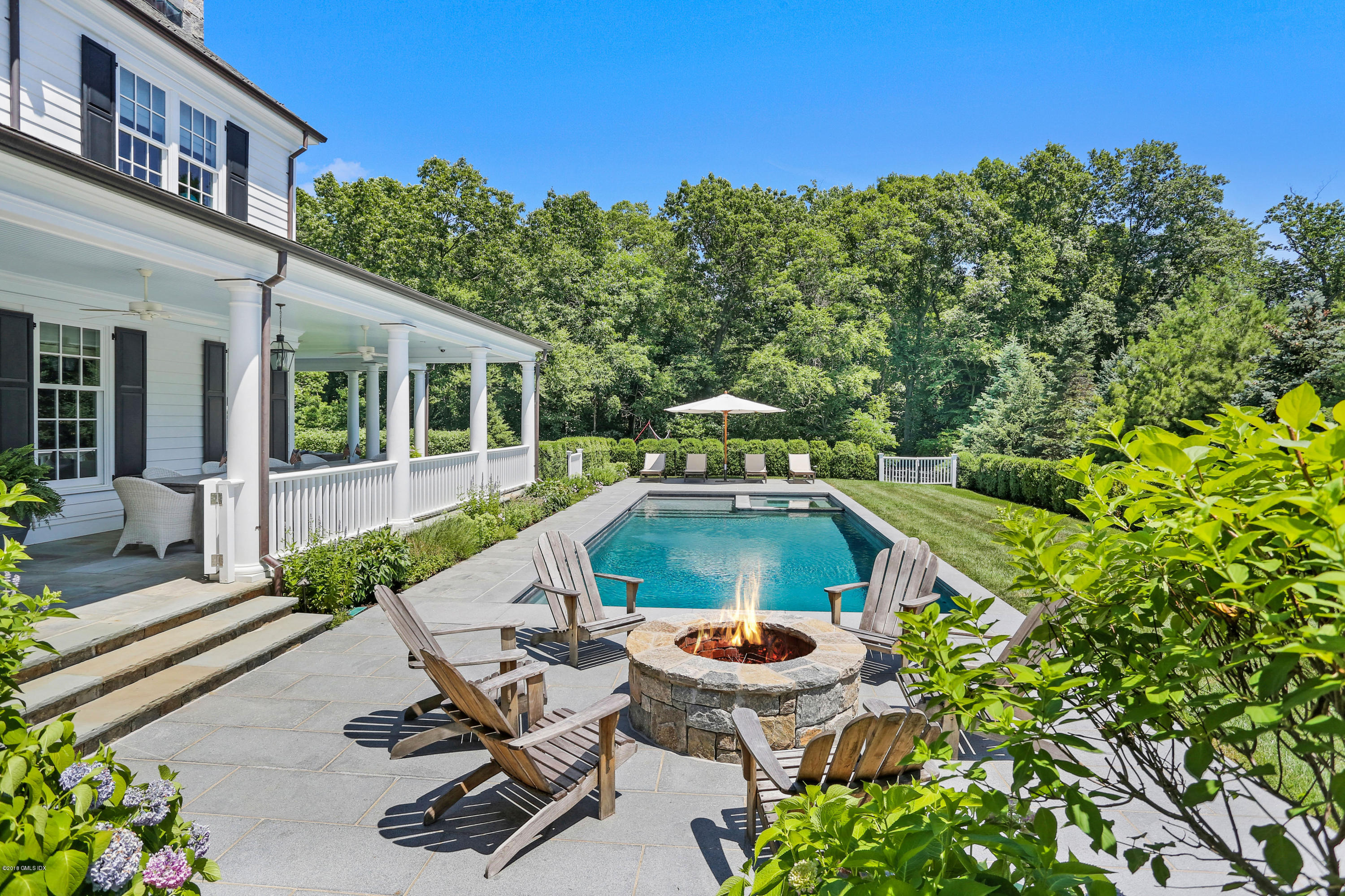 751 Lake Avenue Greenwich, CT 06830 - Photo 2 of 38 a view of house with swimming pool outdoor seating