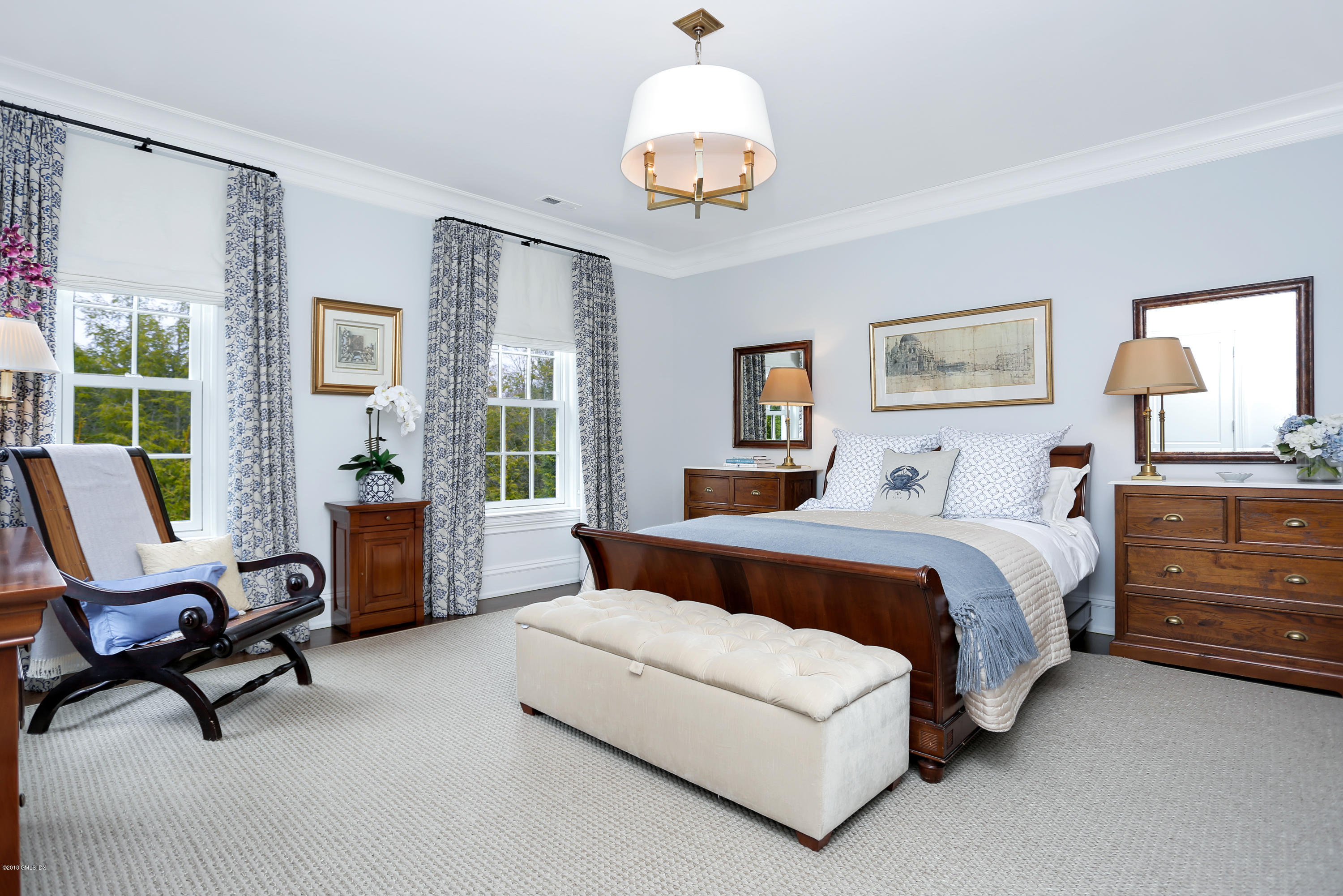 751 Lake Avenue Greenwich, CT 06830 - Photo 21 of 38 a bedroom with a bed a couch and large window