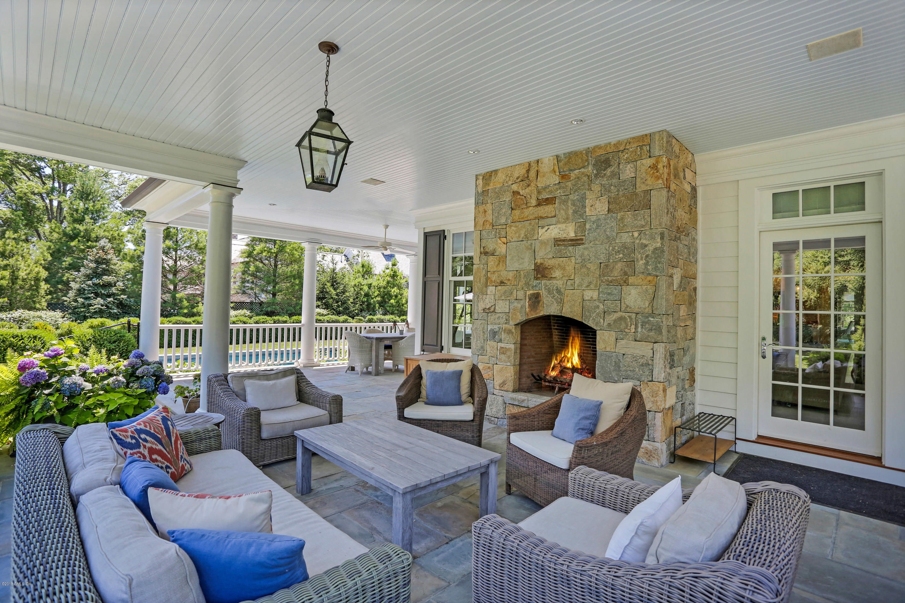 751 Lake Avenue Greenwich, CT 06830 - Photo 31 of 38 a living room with furniture and a fireplace