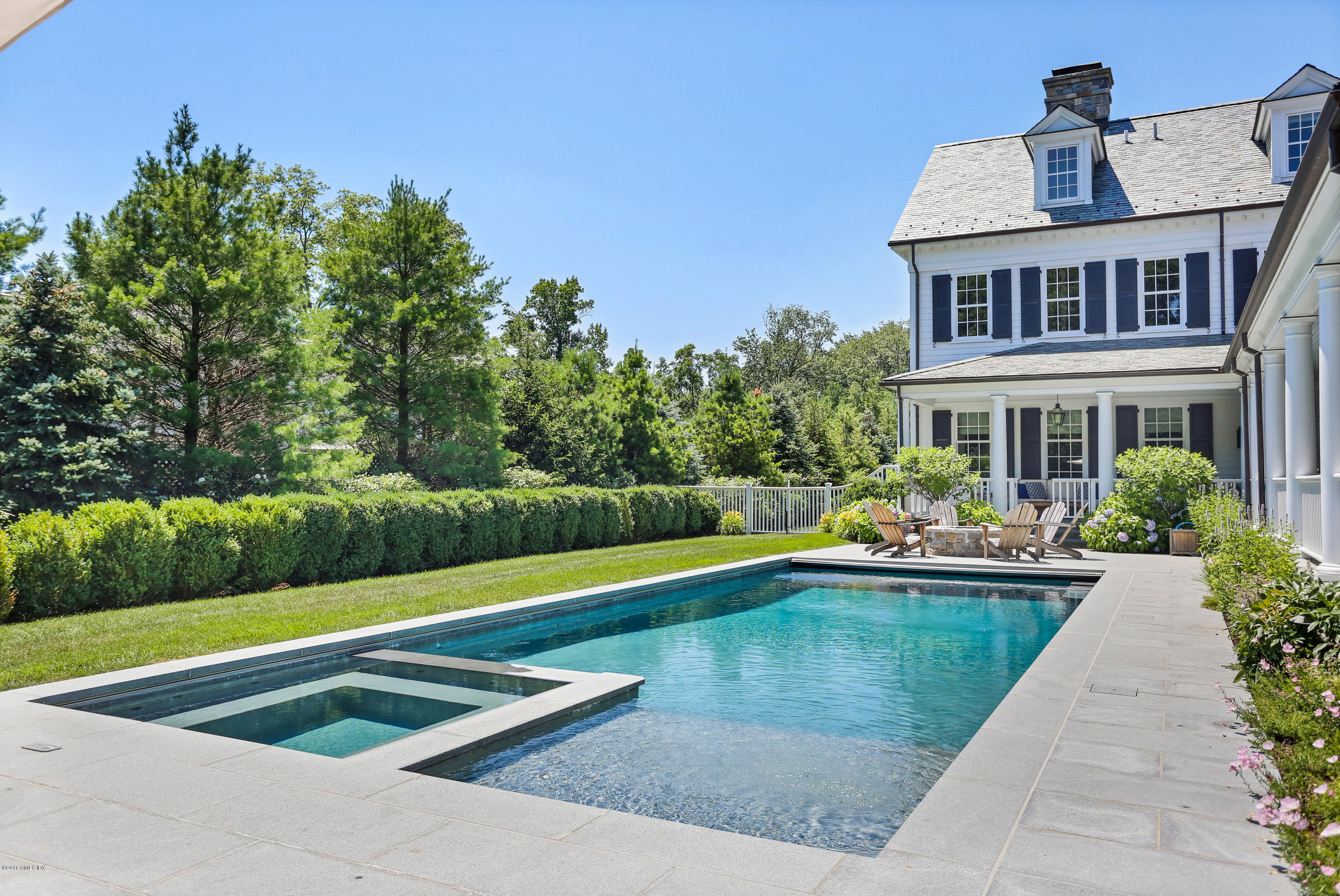 751 Lake Avenue Greenwich, CT 06830 - Photo 35 of 38 a view of swimming pool with lawn chairs and plants