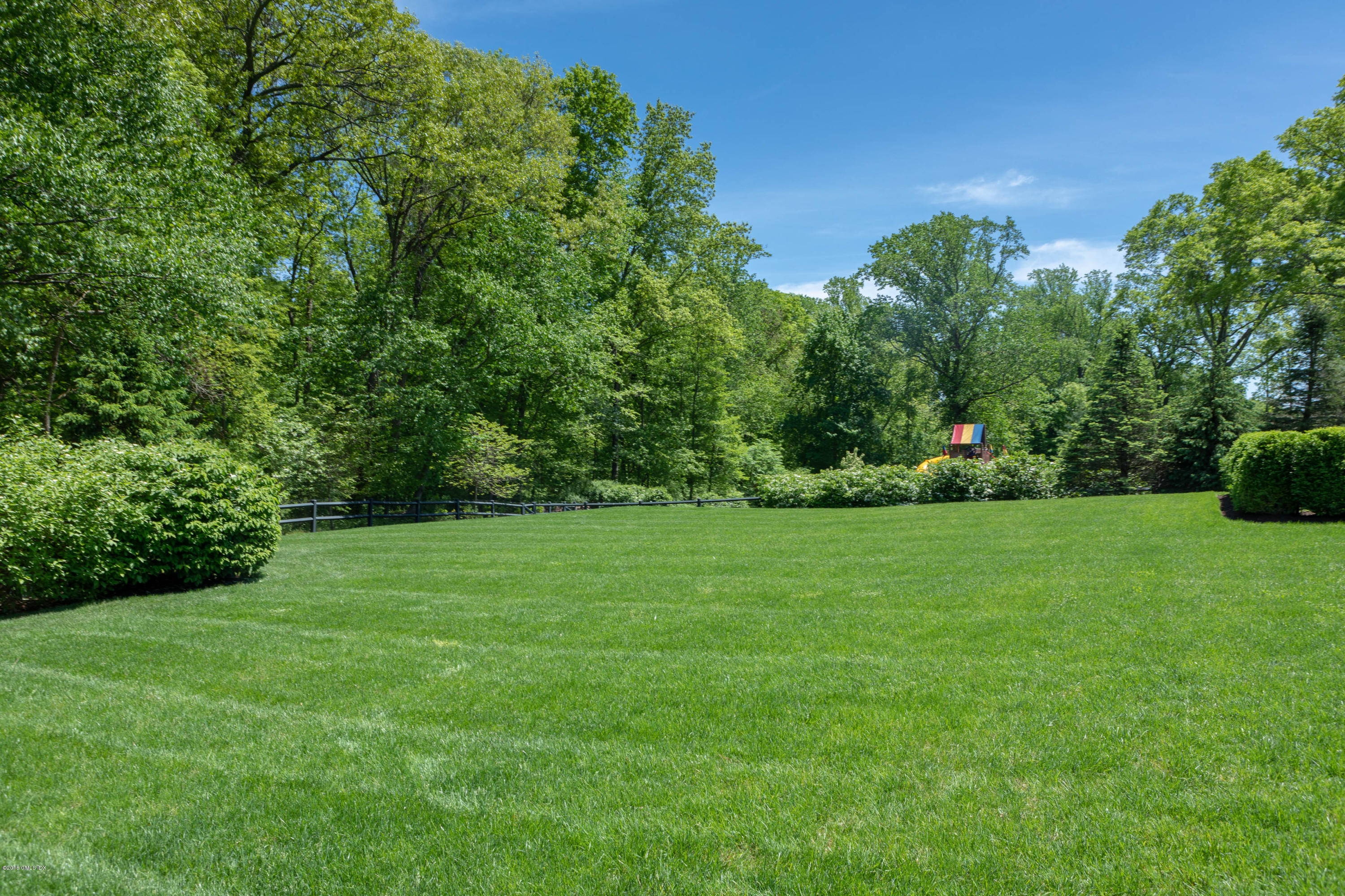 751 Lake Avenue Greenwich, CT 06830 - Photo 37 of 38 a view of a field of grass and trees