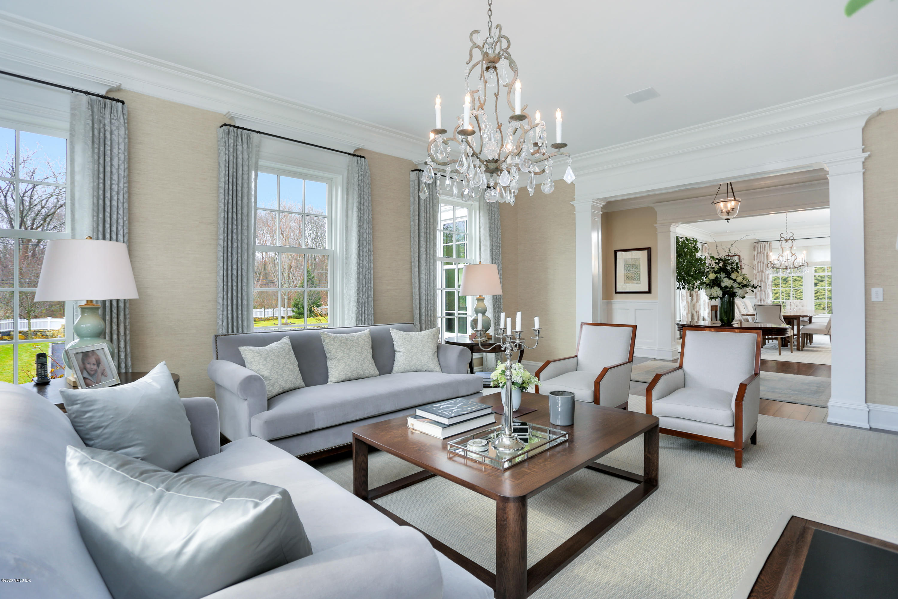 751 Lake Avenue Greenwich, CT 06830 - Photo 4 of 38 a living room with furniture a chandelier a large window and a chandelier