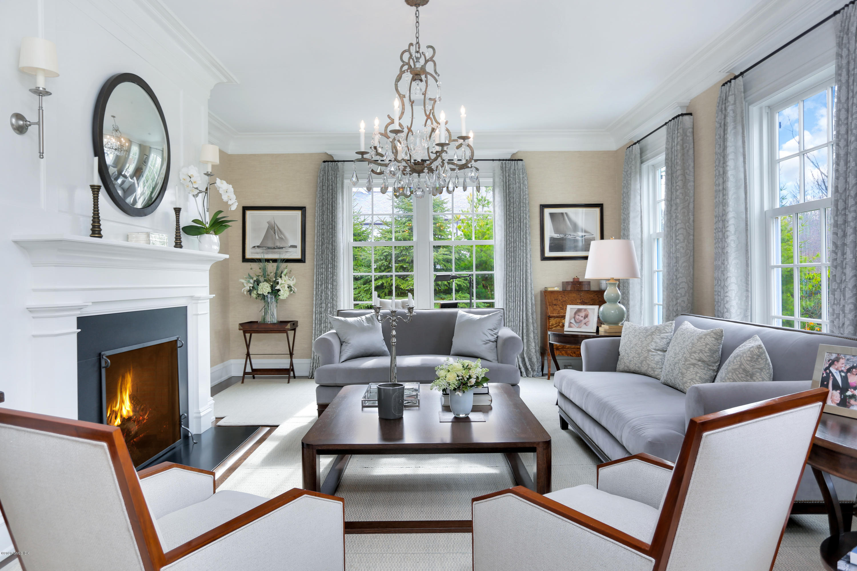 751 Lake Avenue Greenwich, CT 06830 - Photo 5 of 38 a living room with furniture a fireplace and a chandelier
