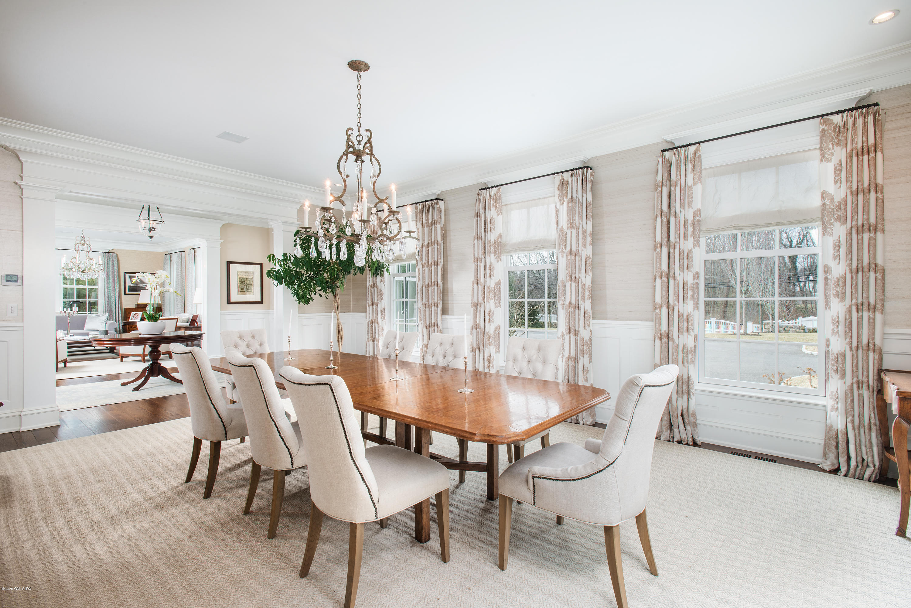 751 Lake Avenue Greenwich, CT 06830 - Photo 6 of 38 a dining room with furniture a chandelier and wooden floor