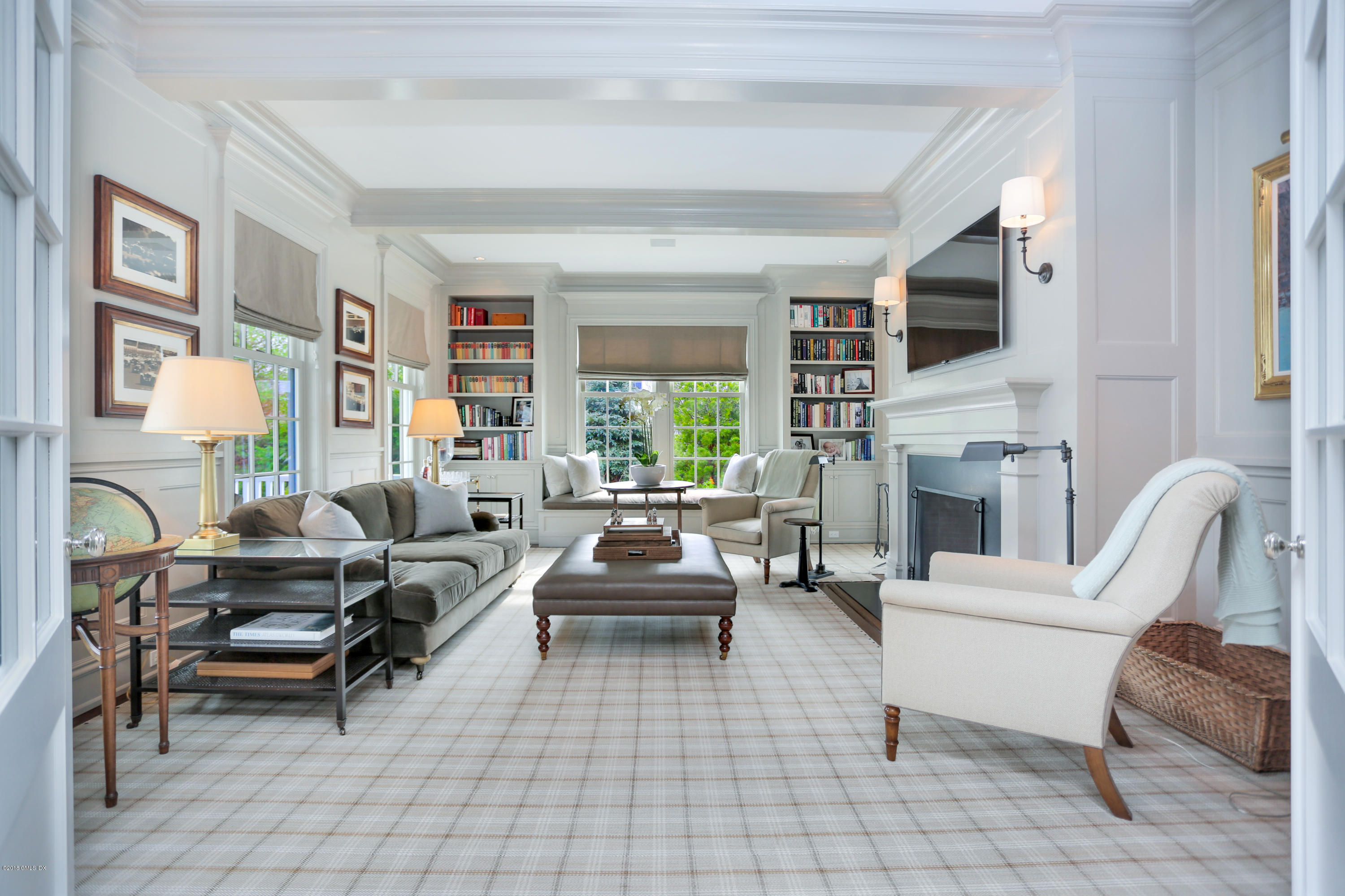 751 Lake Avenue Greenwich, CT 06830 - Photo 7 of 38 a living room with furniture fireplace and a large window