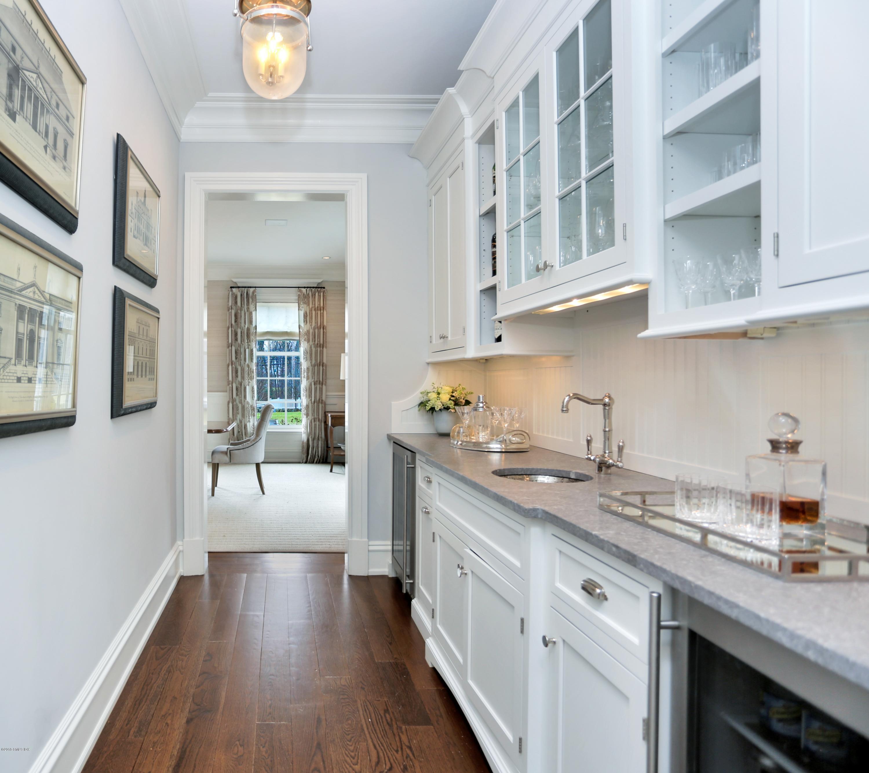 751 Lake Avenue Greenwich, CT 06830 - Photo 8 of 38 a kitchen with cabinets a sink and dishwasher