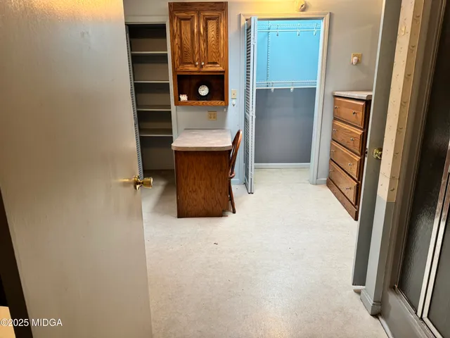 a bathroom with a glass shower door