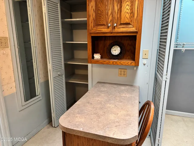 a bathroom with a sink toilet and mirror