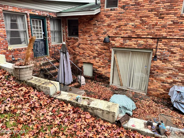 a front view of a house with outdoor seating