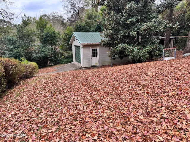 a backyard of a house with lots of green space