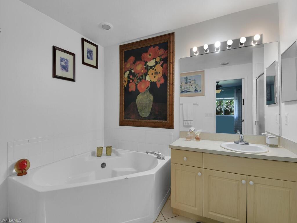 18363 Tulip Road Fort Myers, FL 33967 - Photo 14 of 23 a bathroom with a sink tub and view of bathroom