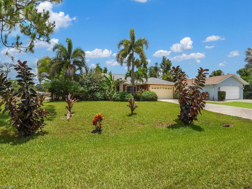 18363 Tulip Road Fort Myers, FL 33967 - Photo 22 of 23 a view of a house with a yard
