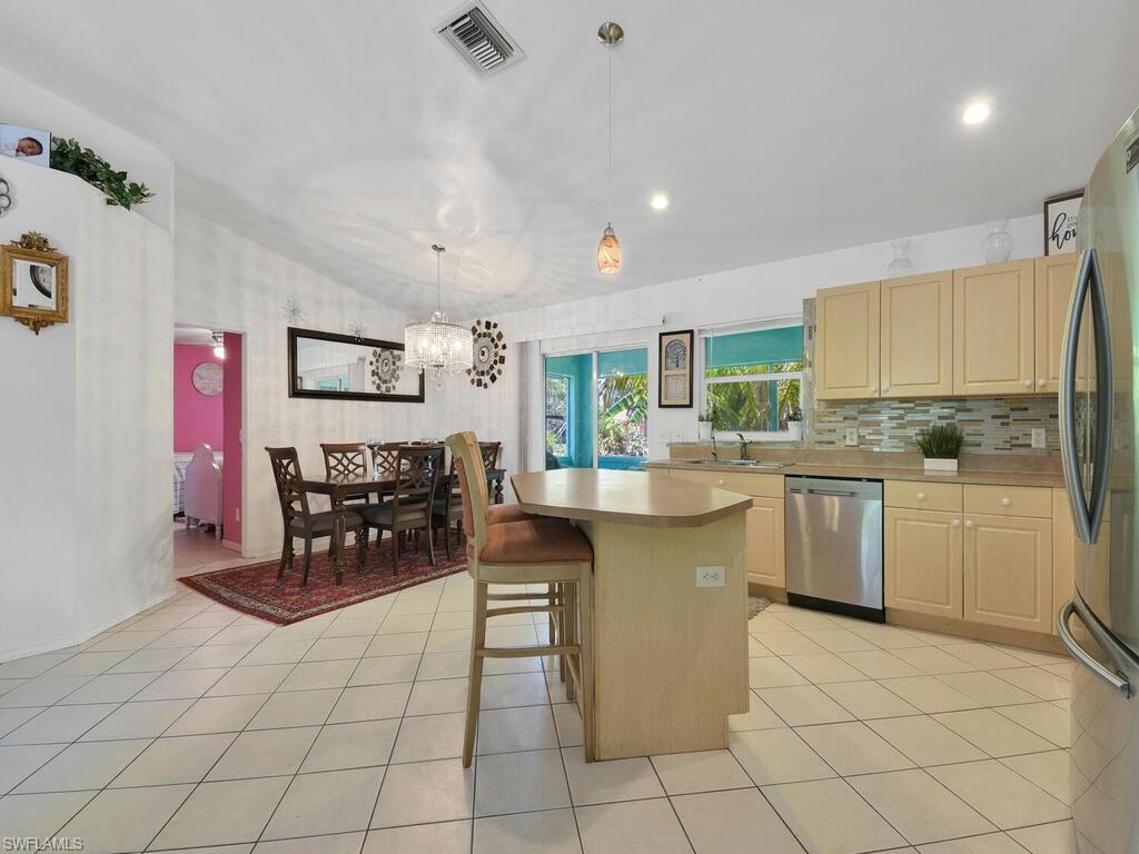 18363 Tulip Road Fort Myers, FL 33967 - Photo 4 of 23 a kitchen with sink cabinets and outdoor counter
