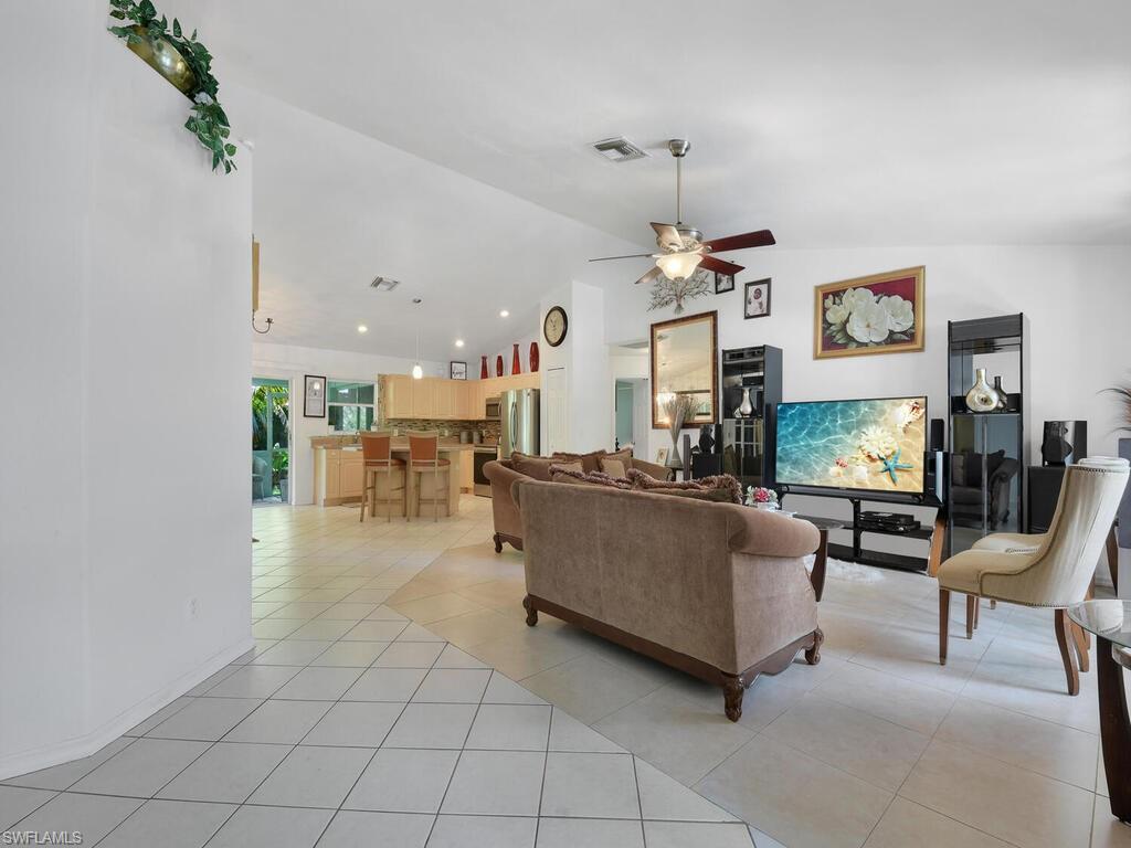 18363 Tulip Road Fort Myers, FL 33967 - Photo 8 of 23 a living room with furniture and a flat screen tv
