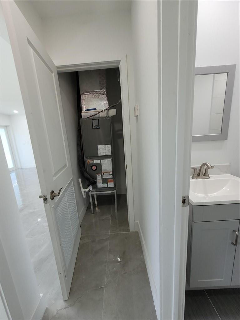 6041 Southwest 17th Street Miami, FL 33155 - Photo 20 of 26 a view of a hallway and a sink