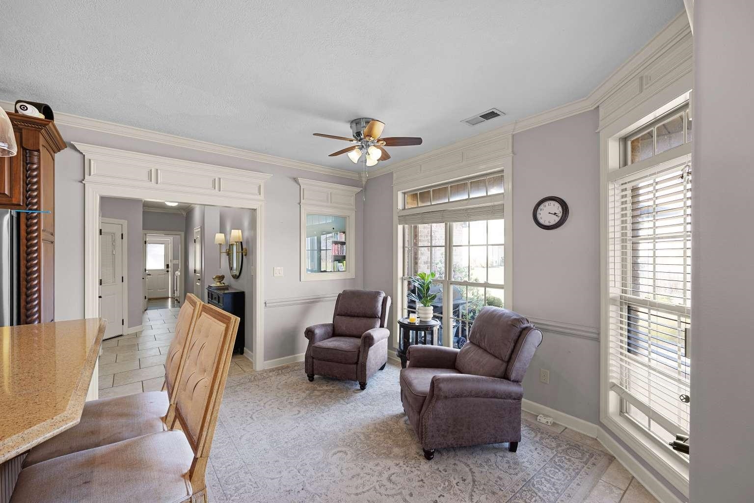 621 Wortham Cemetery Road Bells, TN 38006 - Photo 12 of 25 Living area with crown molding and a ceiling fan