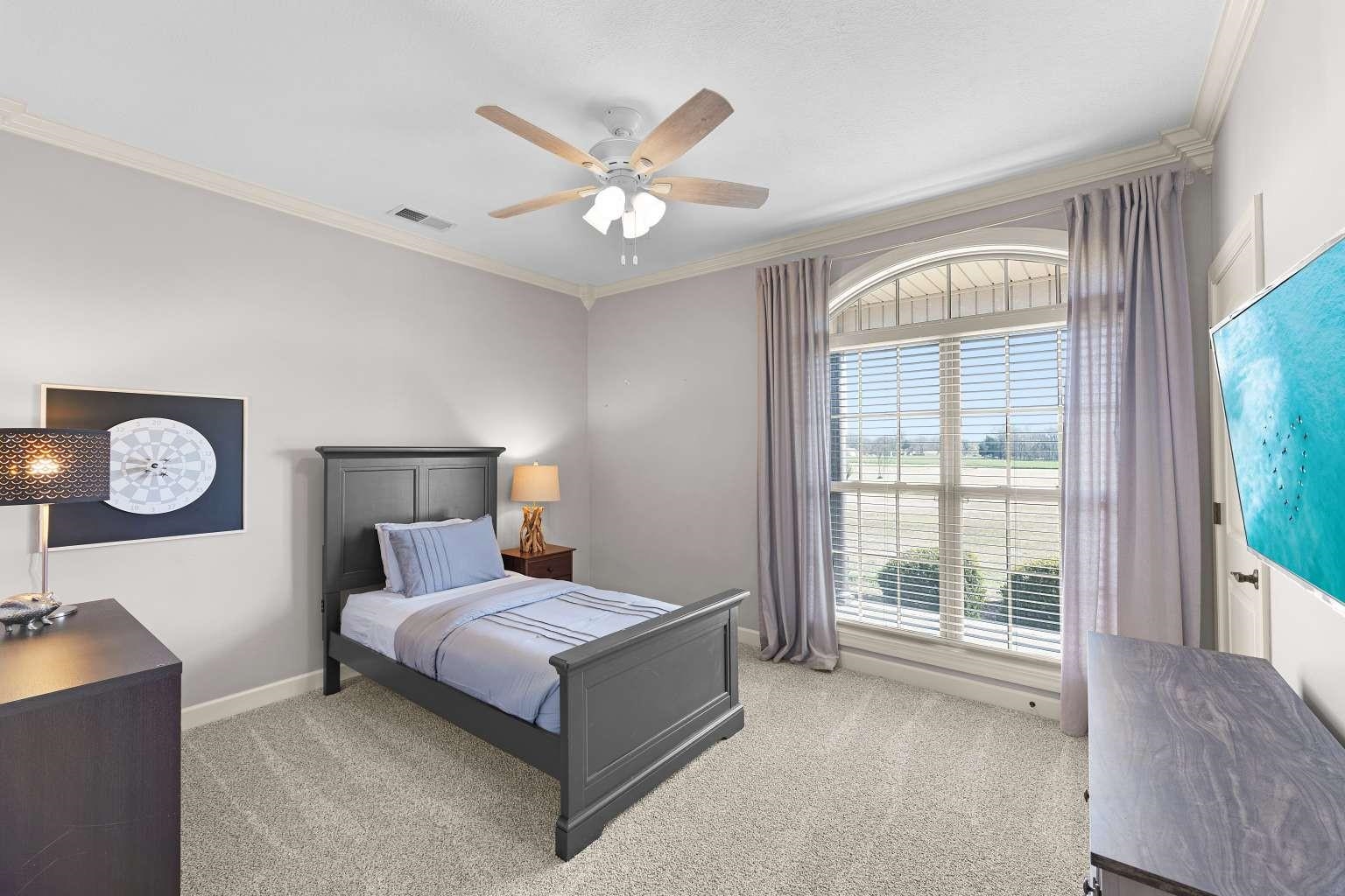 621 Wortham Cemetery Road Bells, TN 38006 - Photo 13 of 25 Bedroom featuring ornamental molding, light colored carpet, and a ceiling fan