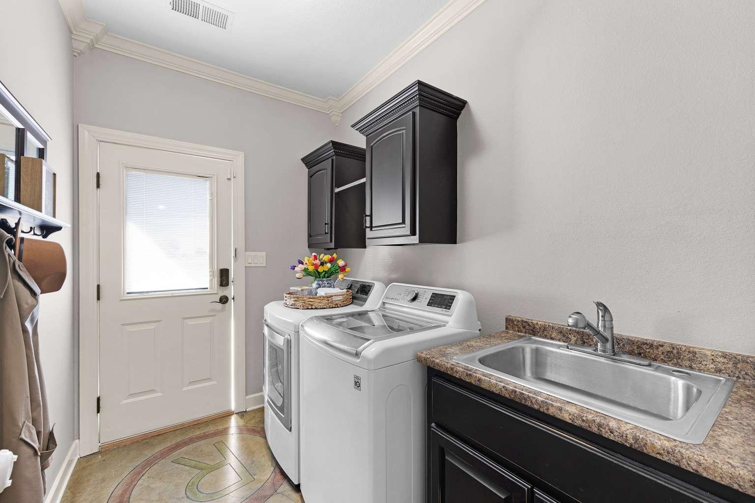 621 Wortham Cemetery Road Bells, TN 38006 - Photo 16 of 25 Laundry room featuring ornamental molding, independent washer and dryer, and cabinet space