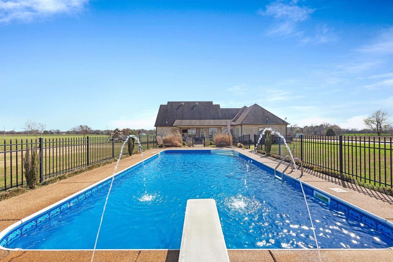 621 Wortham Cemetery Road Bells, TN 38006 - Photo 5 of 25 View of pool featuring patio surround and a diving board