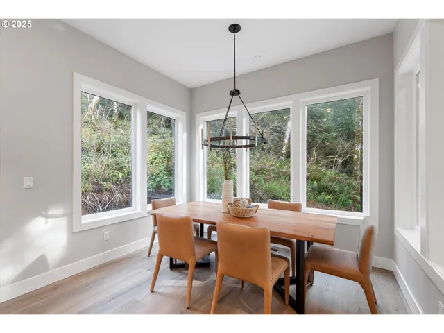 a dining room with furniture window wooden floor