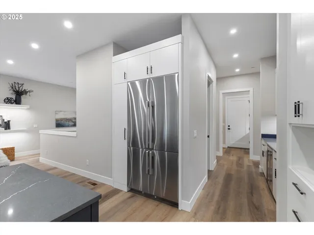 a upper view of a kitchen with a sink and wooden floor