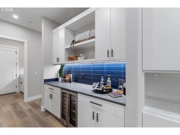 a kitchen with cabinets and window