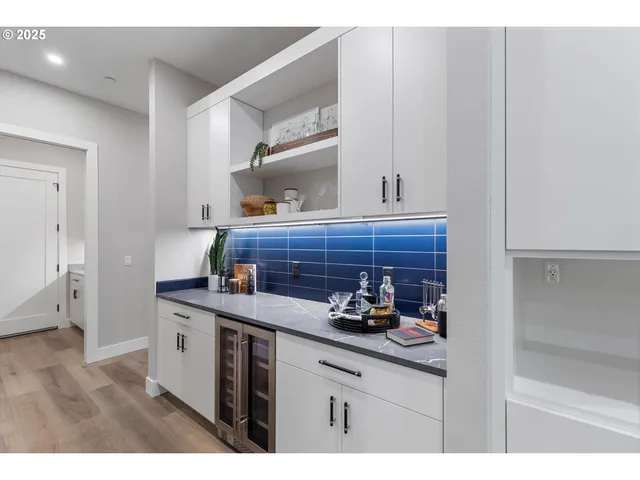 a kitchen with cabinets and window