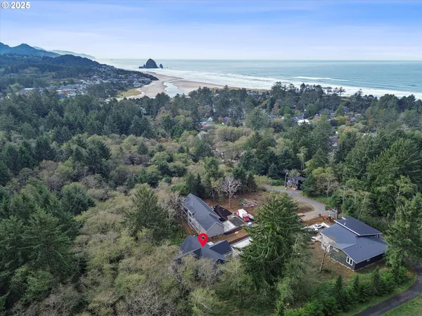 an aerial view of residential houses and outdoor space