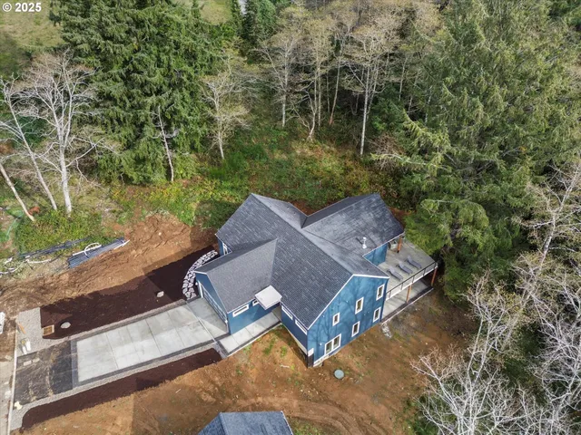 an aerial view of house with yard