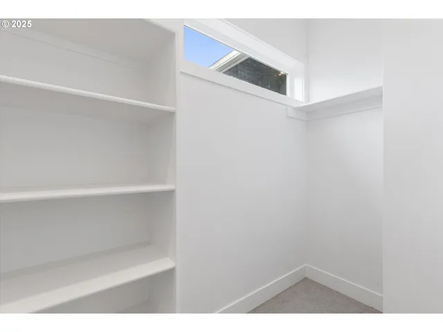 a view of small space with racks on the wall