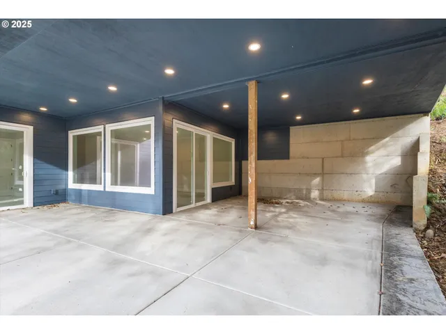 a view of a patio with a backyard