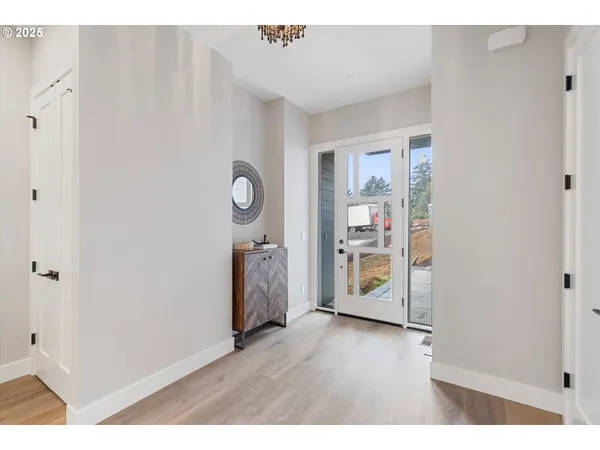 a room with wooden floor and a window