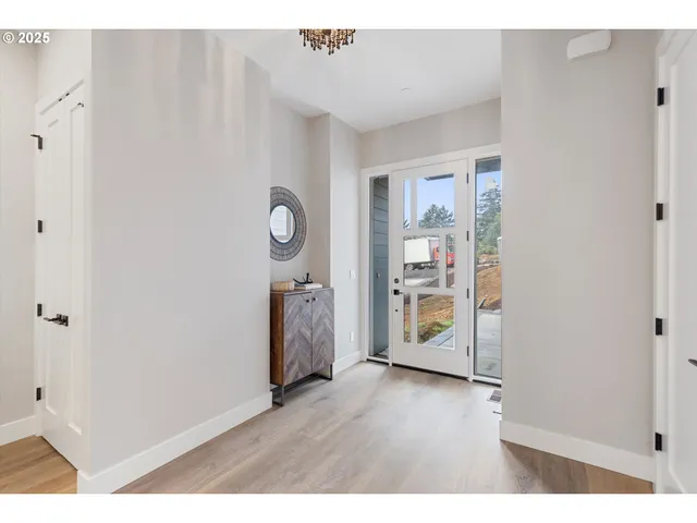 a room with wooden floor and a window