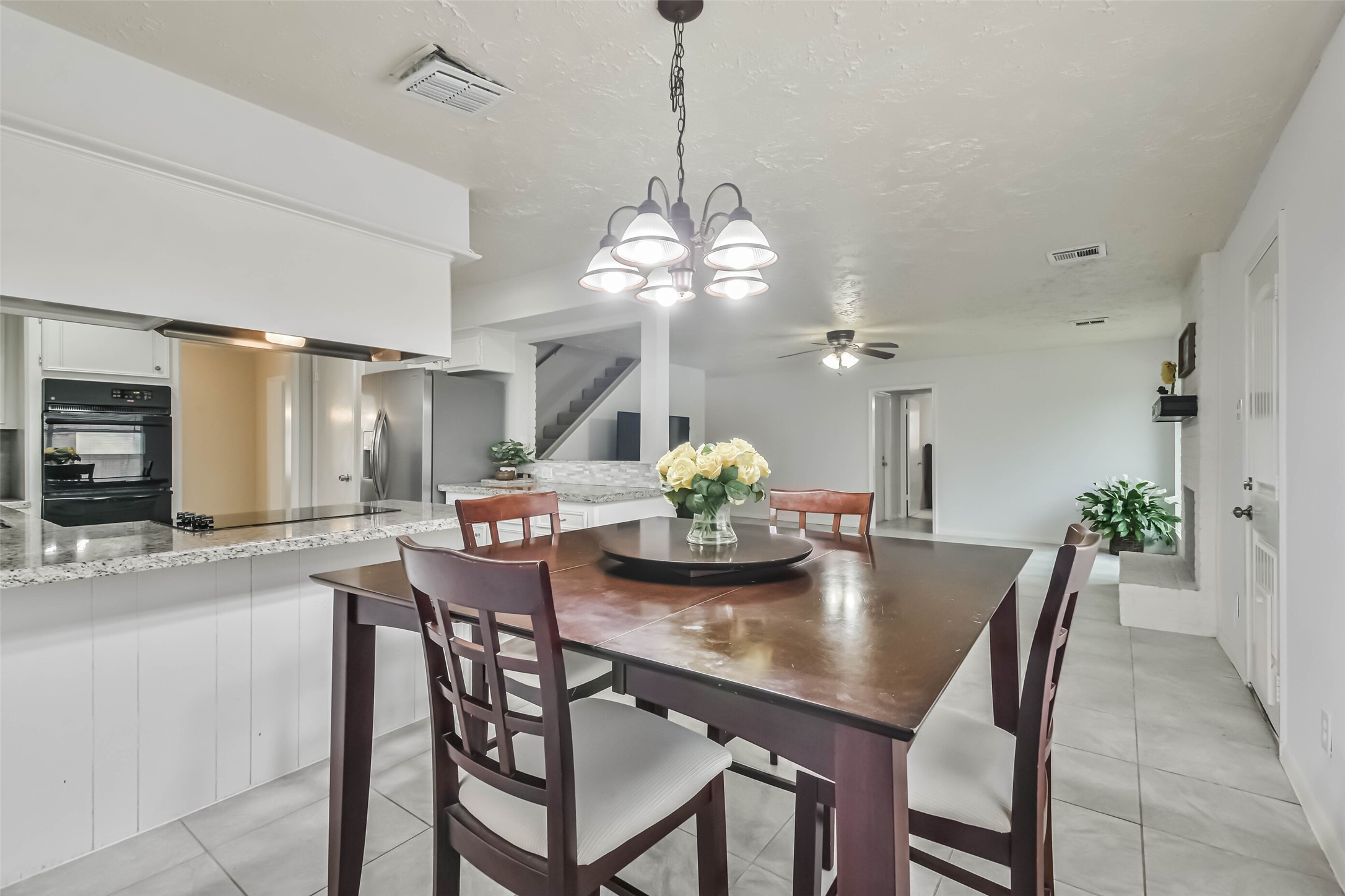 9614 Ballin David Drive Spring, TX 77379 - Photo 14 of 40 a dining room with furniture and chandelier