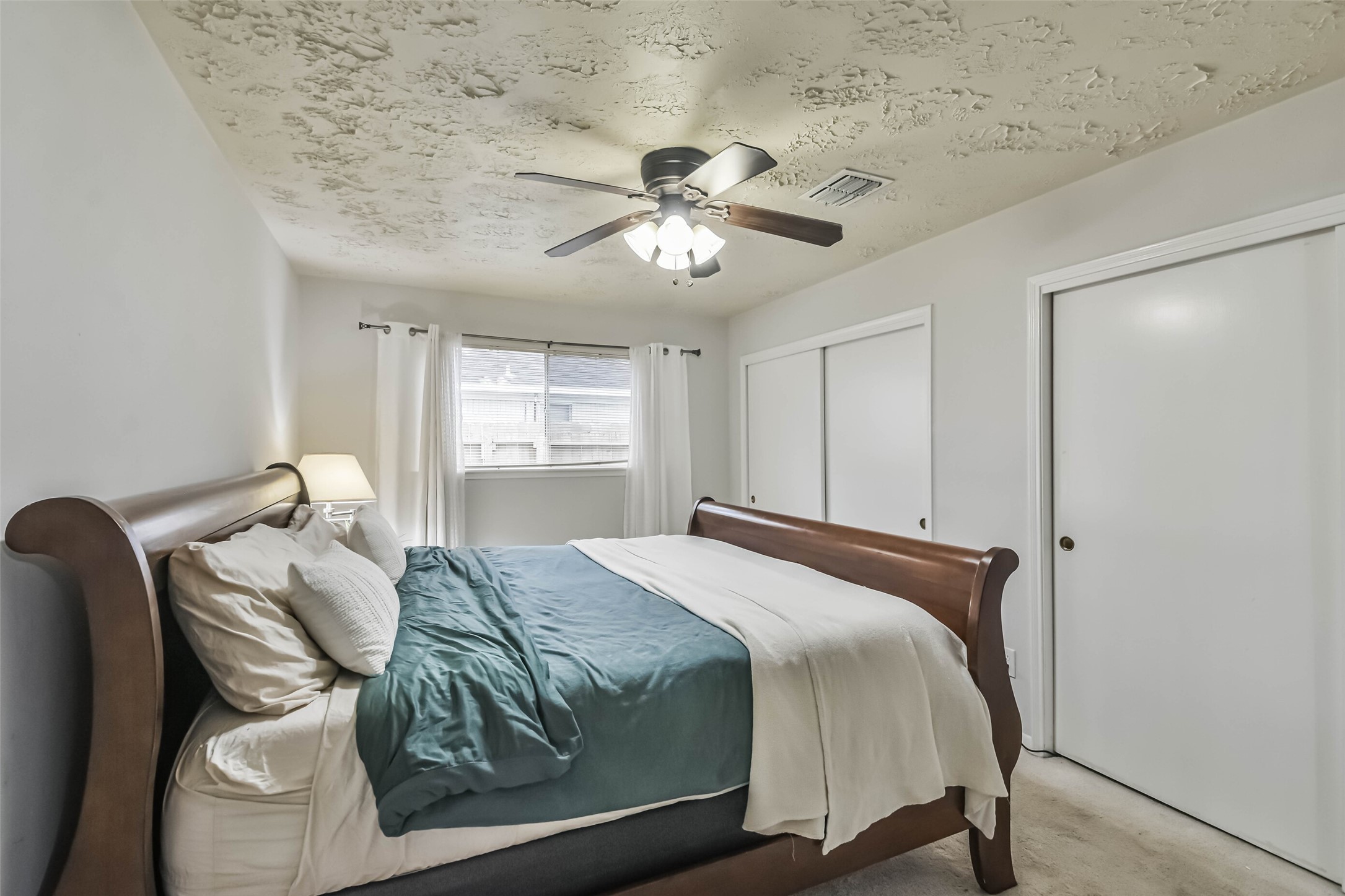 9614 Ballin David Drive Spring, TX 77379 - Photo 20 of 40 a bedroom with a bed and window
