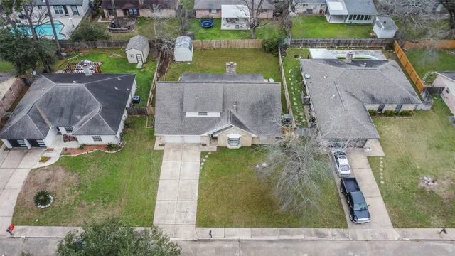 an aerial view of a house with a garden