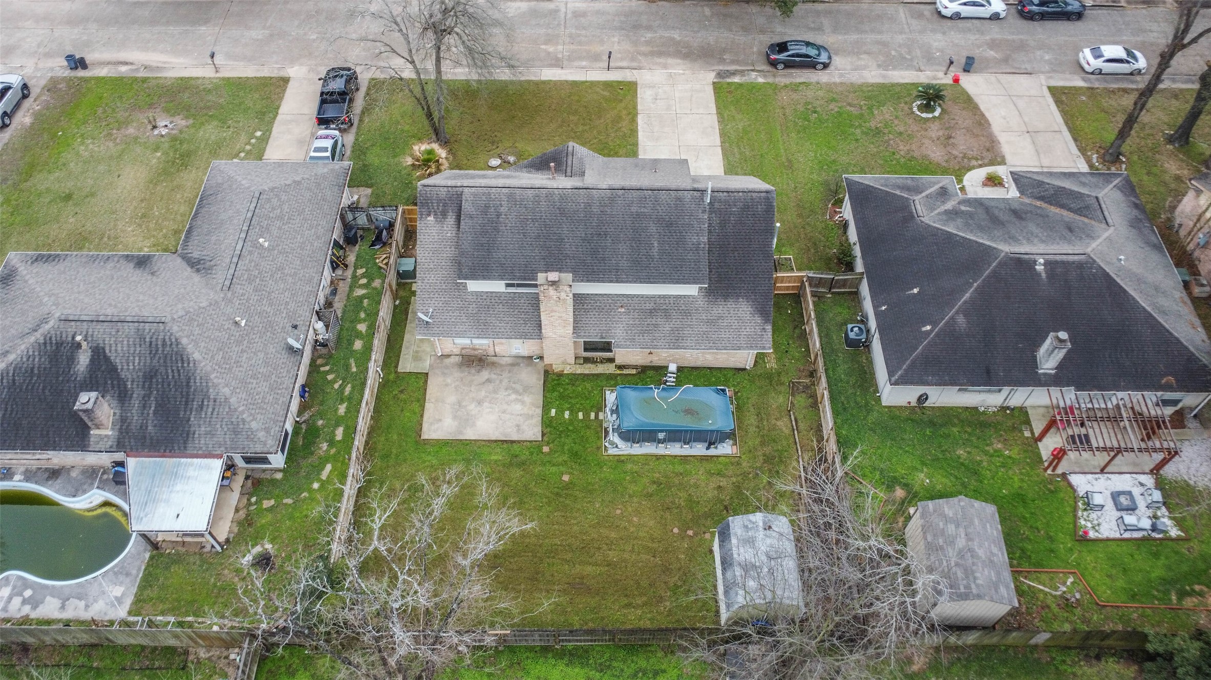 9614 Ballin David Drive Spring, TX 77379 - Photo 39 of 40 an aerial view of a house with garden space and a swimming pool