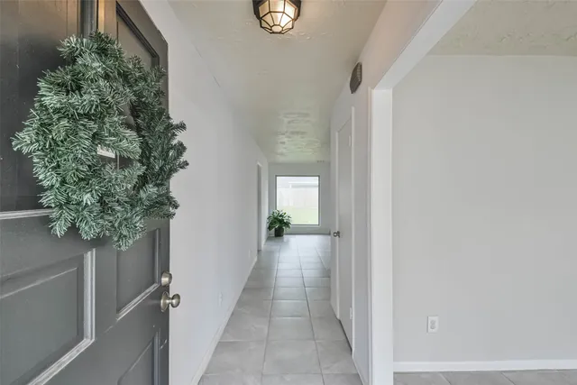 a view of a hallway to back yard