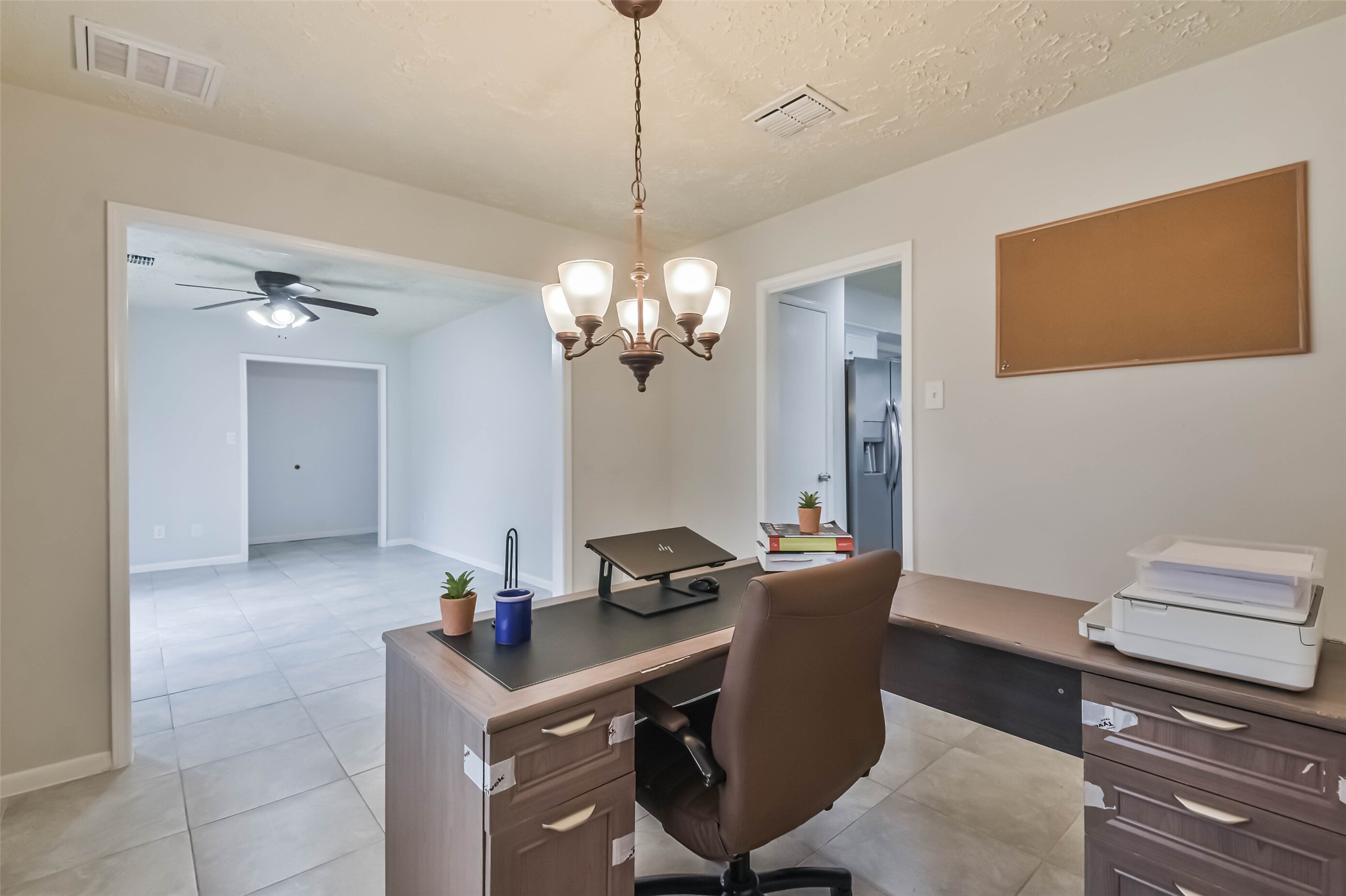 9614 Ballin David Drive Spring, TX 77379 - Photo 9 of 40 a room with a table chairs and wooden floor