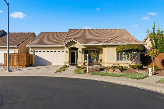a view of a house with sitting area and yard