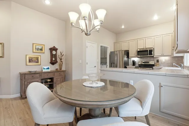 a kitchen with a refrigerator stove and microwave