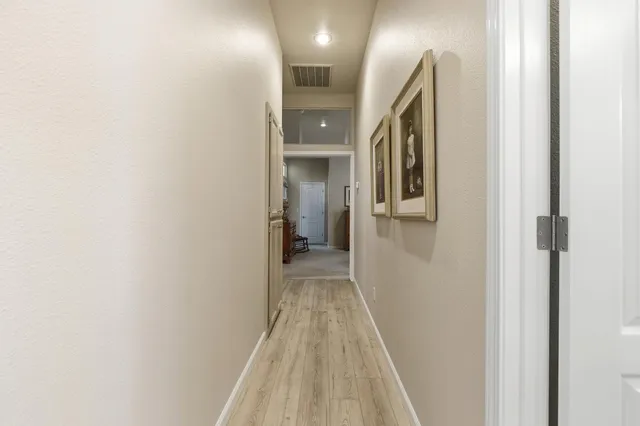 a view of a livingroom with furniture and a ceiling fan